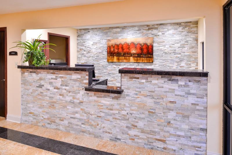 ABVI_TupeloBarnesCrossingMS_Lobby_Front Desk_Angled - 0974101A-CE7E-4869-B60F8F24B40FE7B8
