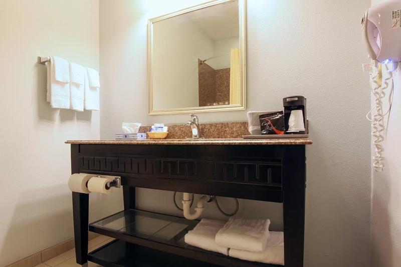 ABVI_SulphurLA_GuestRooms_Bathroom Vanity - 0B13D1AA-E1FD-42E6-BA636266910DFE71