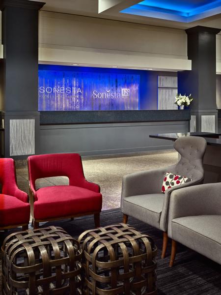 SHR_GwinnettPlaceAtlanta_Lobby_FrontDesk_WithoutAgent - 0D28EA36-5E90-4A65-B0613DF3C0A92B1E