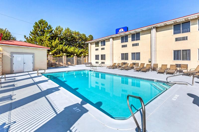 A view the hotel pool with the poolside seating at the hotel