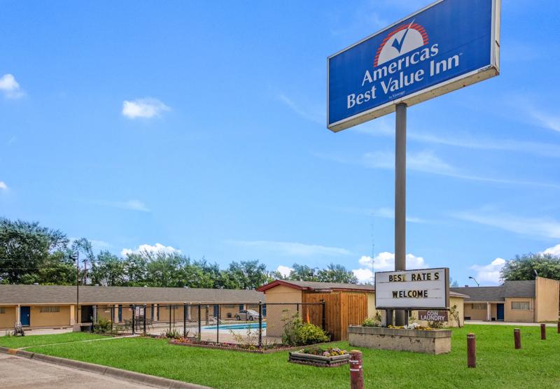 ABVI_GiddingsTX_Exterior_Sign_By Pool - 22242EF3-5B72-4581-AC6F1A89EA2895B4
