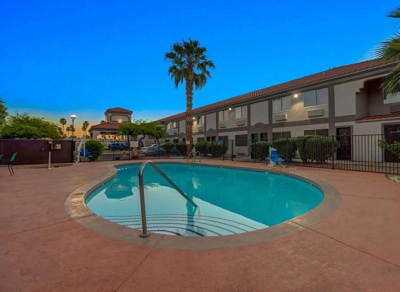An angled view of the stairs in the outdoor pool of the hotel in the evening