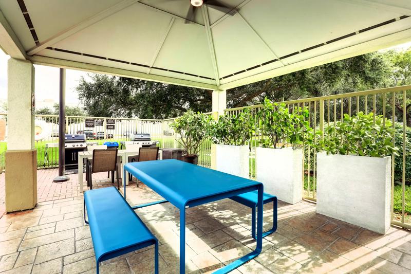 Covered patio with seating during the day