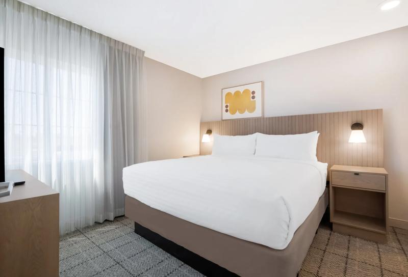 SIM_IrvineEastFoothill_GuestRooms_Suite_Bedroom - 39C90EE0-5E01-4370-88F950D20128DAA1