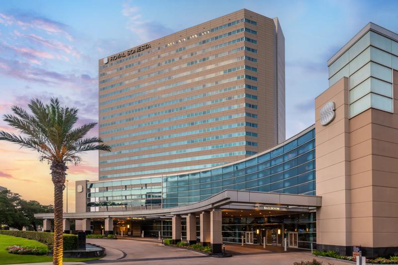 An angled view of the hotel exterior at twilight