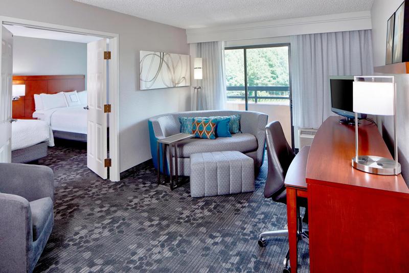 SEL_RaleighDurhamAirportMorrisville_GuestRoom_OneBedroomSuite_2Queens_1 - 3C4B332B-0D91-444B-8E28AE6D091E8F56