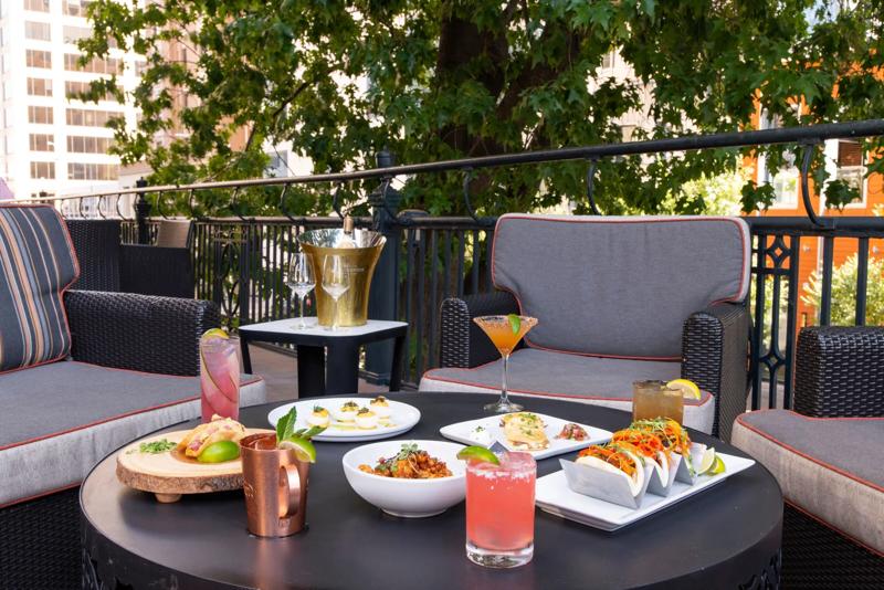 A dining spread of various meals and cocktails at Stephen Fs Bar