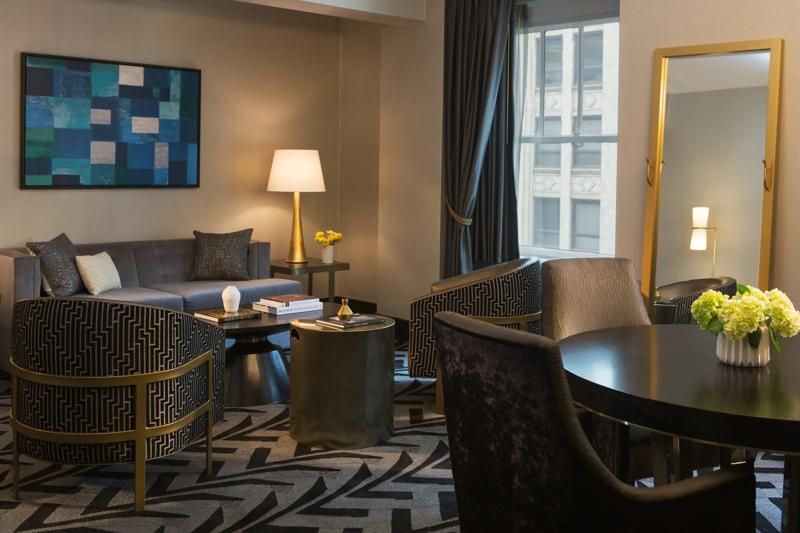 TRS_AllegroChicago_GuestRoom_Suite_1Bedroom_LivingRoomAndDiningTable