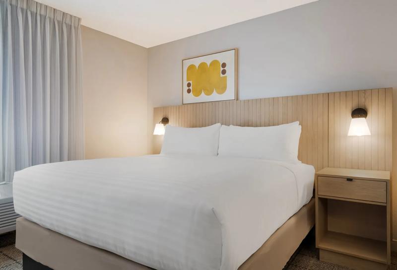 Bed area with nightstands in a studio room