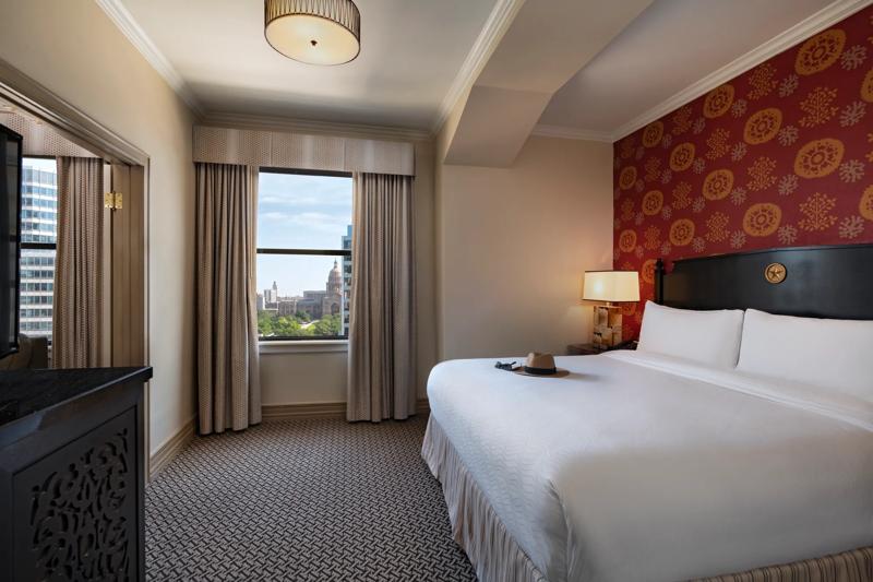 The bedroom with a hat on the bed in a One Bedroom Suite