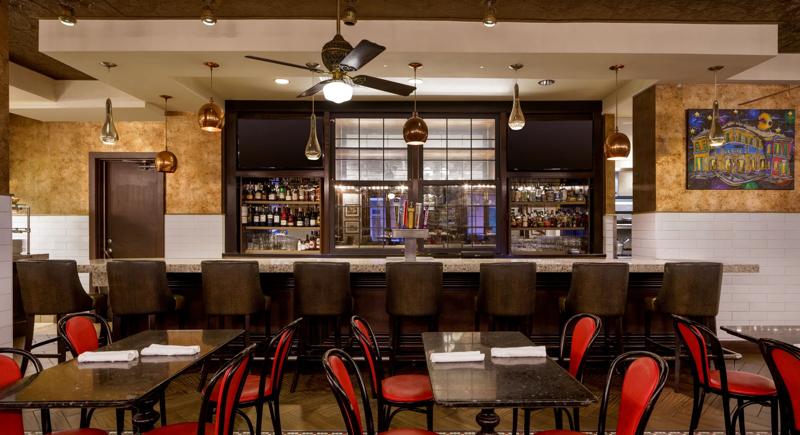 The dining room seating and bar at Desire Oyster Bar