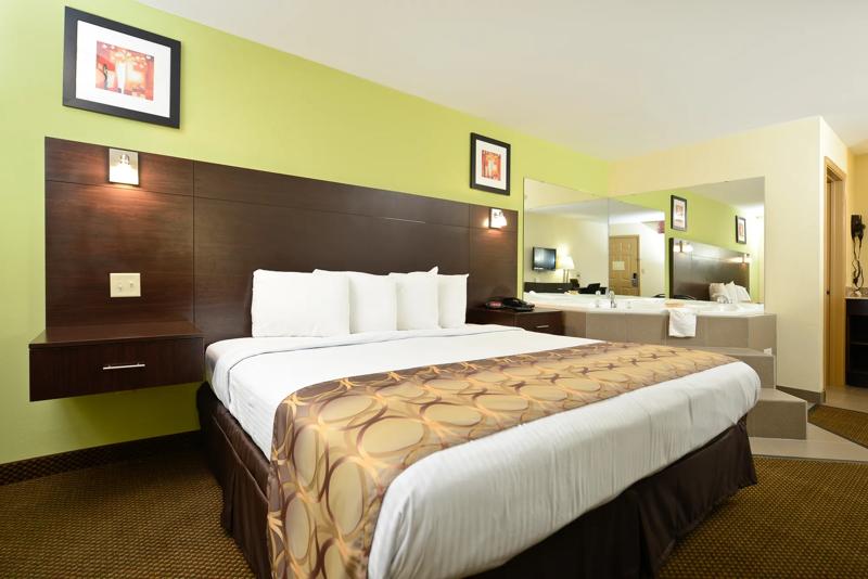 ABVI_LakeCharlesExit11LA_GuestRooms_Jacuzzi Suite_Bed - 62D5D198-F5DA-4AD8-930BFF0E75E77203