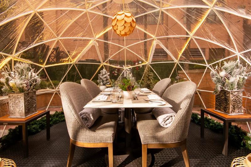 A dining set up in a Proof Lodge Igloo