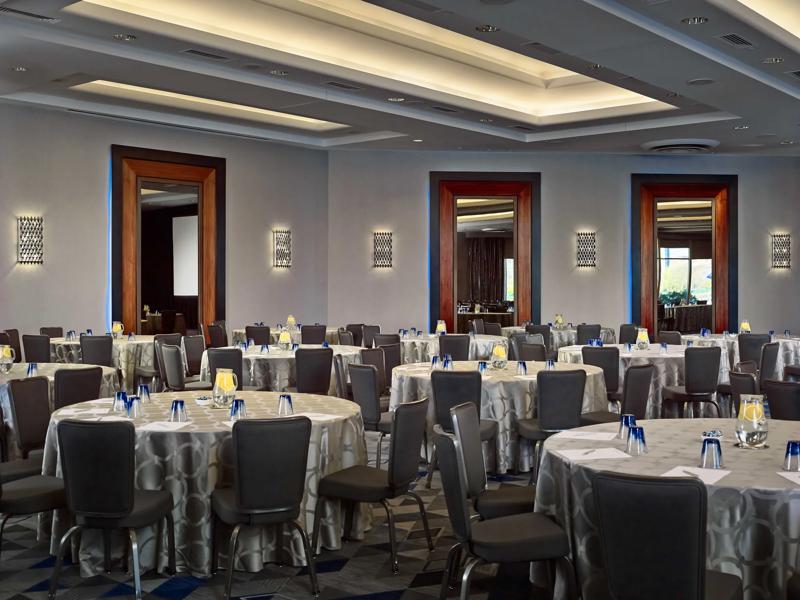 The grand ballroom set up in table rounds for a meeting