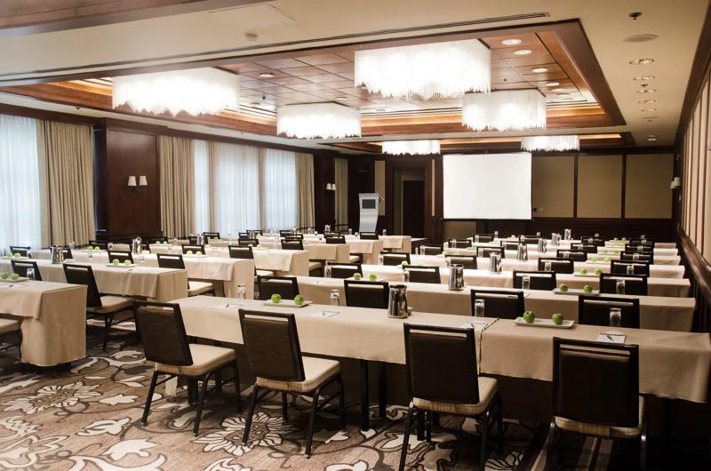 A angled view of the classroom set up for a meeting in the Willard Room