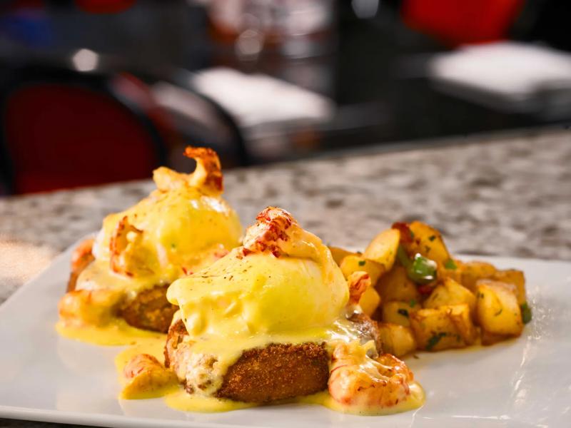 A close up of shrimp smothered crab cakes at Desire Oyster Bar