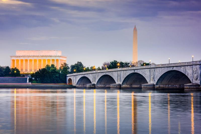 Washington DC, USA skyline on the Potomac River with Lincoln Memorial, Washington Memorial, and Arlington Memorial Bridge.