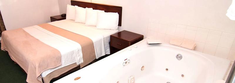 ABVI_ZumbrotaMN_GuestRooms_Deluxe Queen with Jacuzzi_Bed and Jacuzzi - A853D943-9CA5-40B5-A982ED42E979B2F8