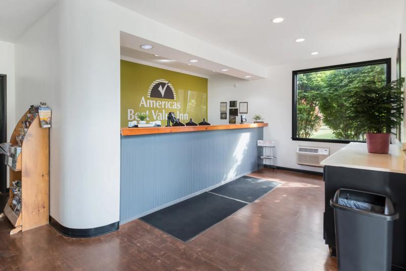 ABVI_PaintedPostNY_Lobby_Front Desk_Angled - AAFDDCA9-CABC-4D97-88FF01A371F492D4