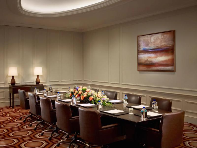 A meeting space set up in a boardroom style