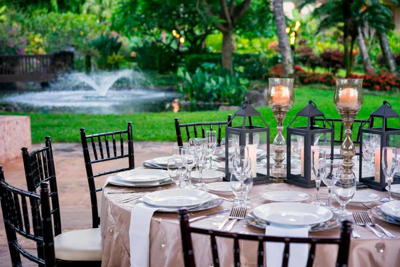 A close up of a dining set up for an outdoor meeting