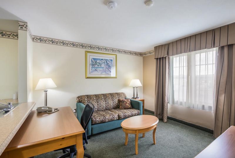 ABVI_ThreeRiverMI_GuestRooms_Queen Suite_Seating - CC5493D7-C05C-495F-889675BA036E149D