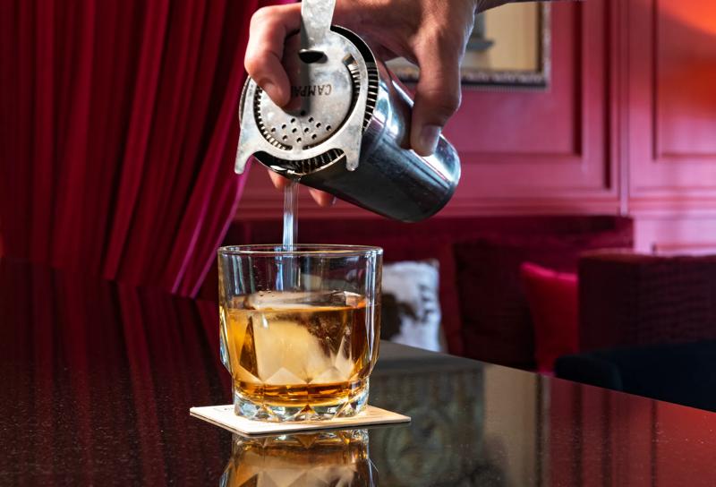 A close up of a cocktail mid pour at Stephen Fs Bar