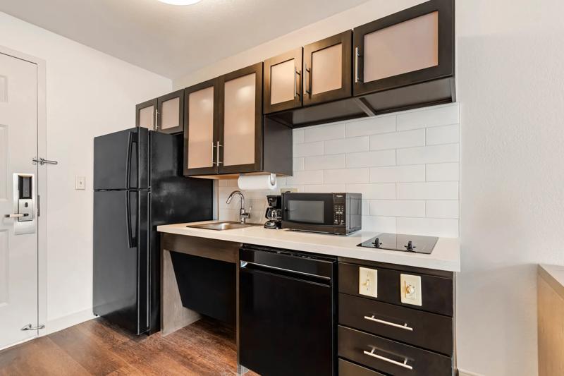 ADA Kitchen with roll-under sink, and appliances