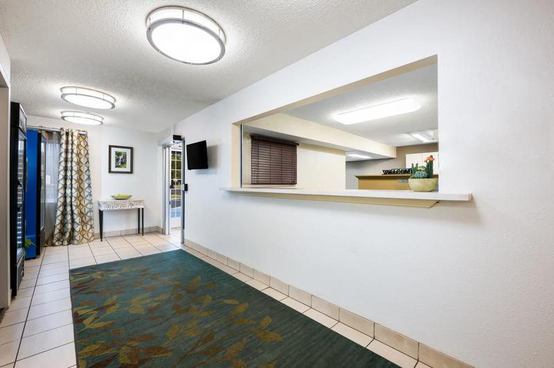 SIM_HuntsvilleResearchPark_Lobby_Front Desk_Angled - E423C227-BAF2-41C9-BEC00B78FEFDA7F0