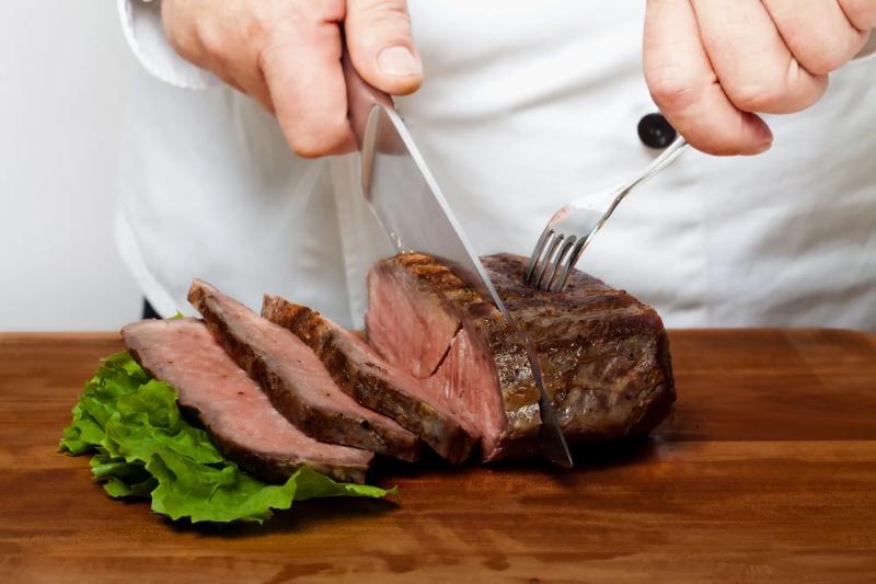 Carving the roast beef.